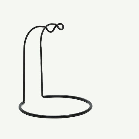 Black fishing reel stand on a white background