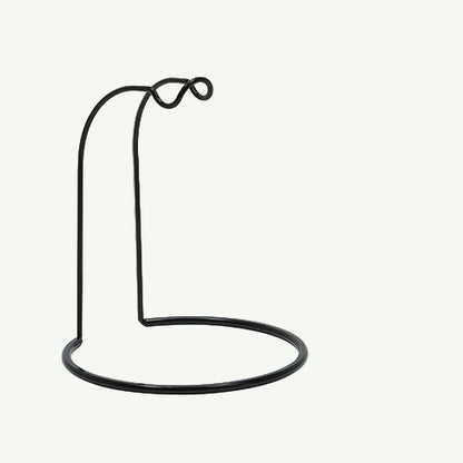 Black fishing reel stand on a white background